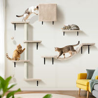 Produktbild von Dripio Katzenkletterwand 10-teiliges Set mit Kratzbäumen Hängematte und Bett