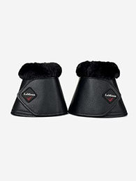 Produktbild von LeMieux Gamaschen für Pferde aus Kunstleder in Schwarz mit weichem Fellrand und Klettverschluss Größe L