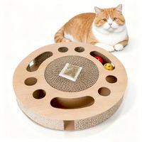 Produktbild von Nobleza Katzenkratzbrett aus Kratzpappe mit 2 Klingelballs rund 33 x 33 x 5,5 cm